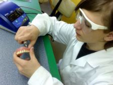 Michal is finishing his first upper complete denture.