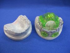 Open Klammt activator with tongue barrier and lip pad of a truss